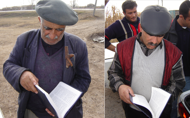 Azeri men browsing through a Bible.